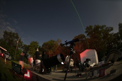 Gil Jeffers test the on site laser during the AAA Astrophotography class field trip to UACNJ facilities in Jenny Jump State Park on May 18. Photo by Stan Honda