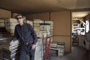 Russ Rauchfuss in a former barracks building, used as a “honey house” for the family beekeeping business.